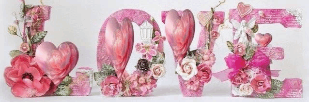 the word love is decorated with pink hearts and flowers
