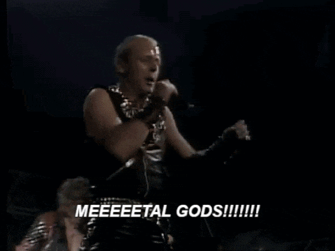 a man is playing a guitar in a dark room with the words meeeeetal gods written in white