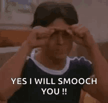 a man is giving a thumbs up and says yes i will smooch you !