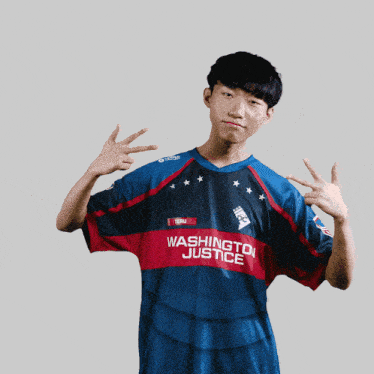 a young man wearing a washington justice jersey