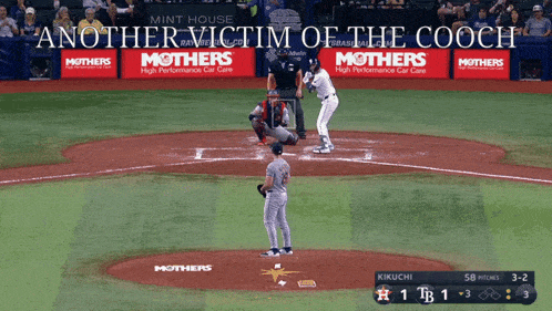 a baseball game is being played with advertisements for mothers on the fence