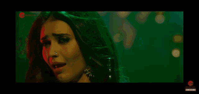 a close up of a woman 's face with the words music co. on the bottom right