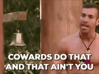 a shirtless man is standing in front of a bell and says `` cowards do that and that ain 't you ''