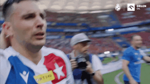 a man in a blue and white jersey with a star on it