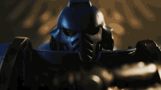 a close up of a robot 's face with a helmet on