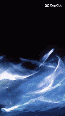 a black background with a blue smoke coming out of it and the caption capcut
