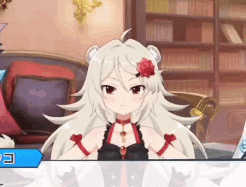 a girl with white hair and a red rose on her head is sitting on a couch .