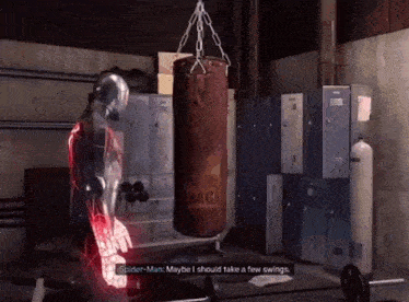 a spider-man talking to another spider-man in front of a boxing bag that says naga