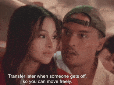 a man and a woman are looking at each other with the words transfer later when someone gets off so you can move freely visible