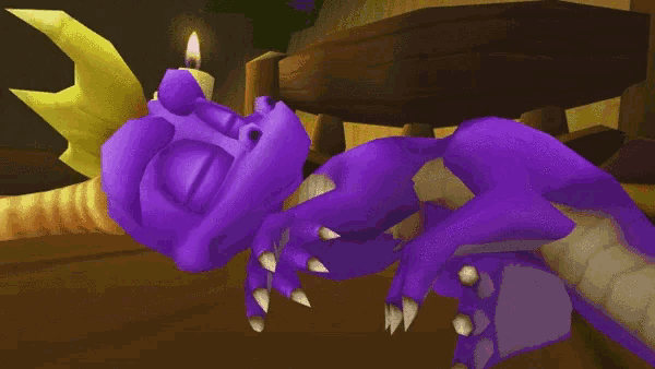 a purple dragon with a yellow crown laying down with a candle in the background