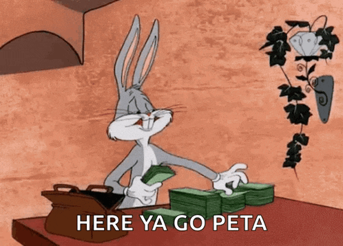 bugs bunny is sitting at a table holding a stack of money and says here ya go peta