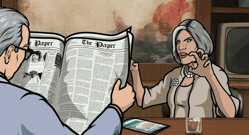 a man is reading a newspaper with the paper on it