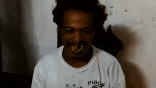 a man is wearing a white shirt with pisces on the front