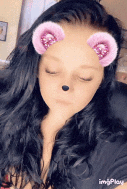 a close up of a woman 's face with a snapchat filter