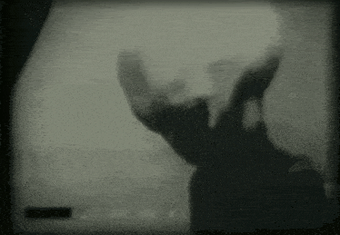 a black and white photo of a silhouette of a person 's head .