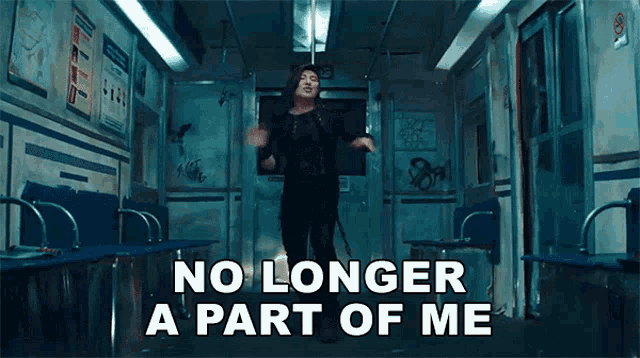 a woman is dancing on a train with the words " no longer a part of me " above her