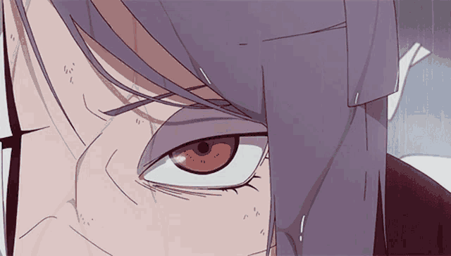 a close up of a person 's eye with purple hair and red eyes