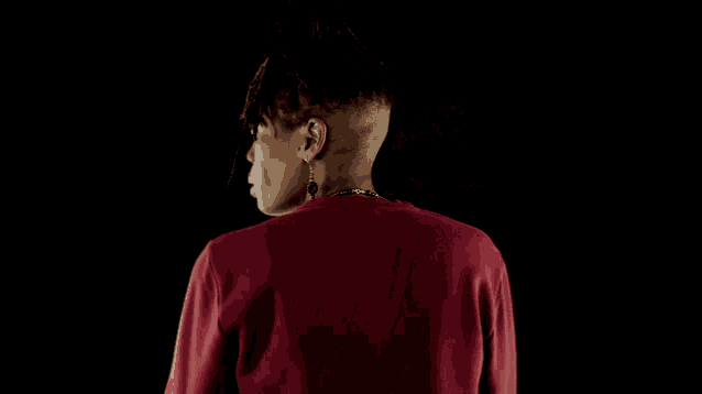 the back of a man wearing a red sweatshirt