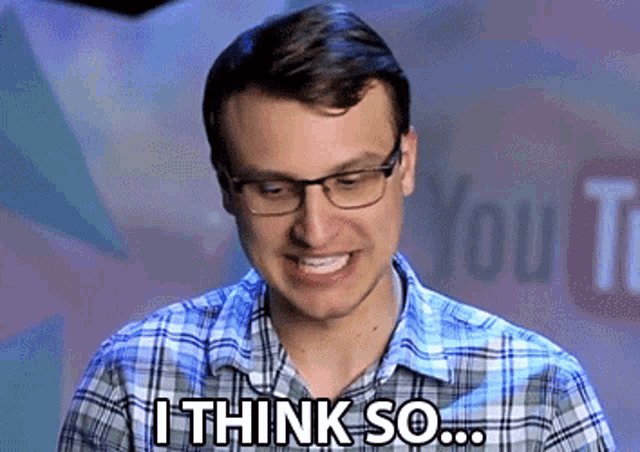 a man wearing glasses and a plaid shirt says " i think so "