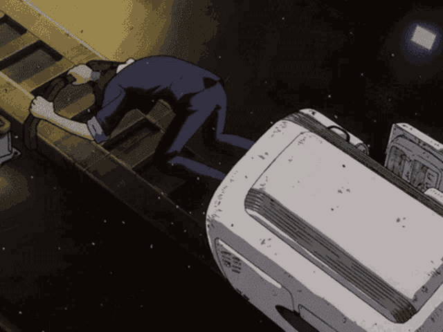 a cartoon of a man kneeling down next to a machine that says ' a ' on it