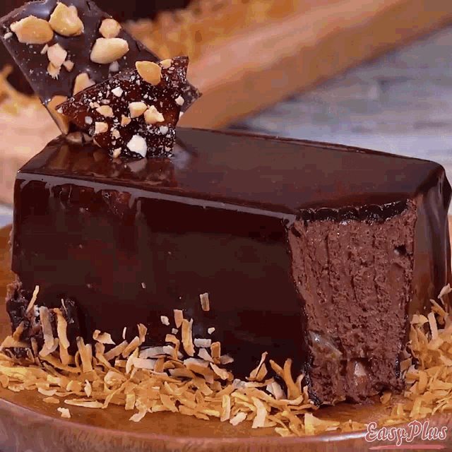 a piece of chocolate cake on a plate with easy plus written on the bottom right
