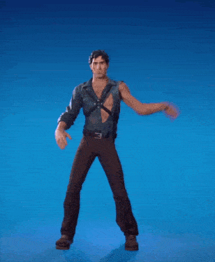 a man in a blue shirt and brown pants is dancing