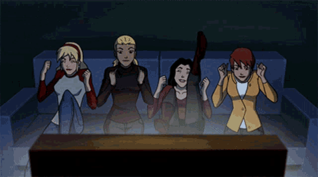 a group of girls are sitting on a couch watching a tv