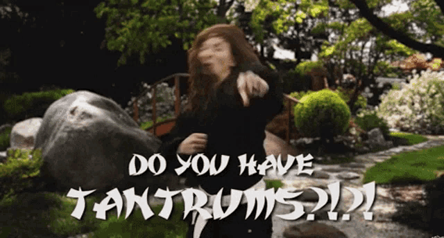 a woman dancing in a garden with the words do you have tantrums written on the bottom