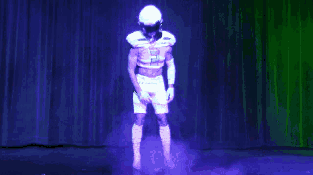a football player is projected on a screen with the number 50 on his jersey