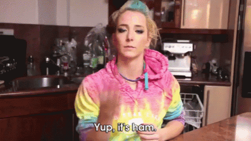 a woman in a colorful tie dye sweatshirt says yup it 's ham