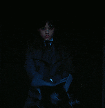 a woman in a trench coat holds an umbrella