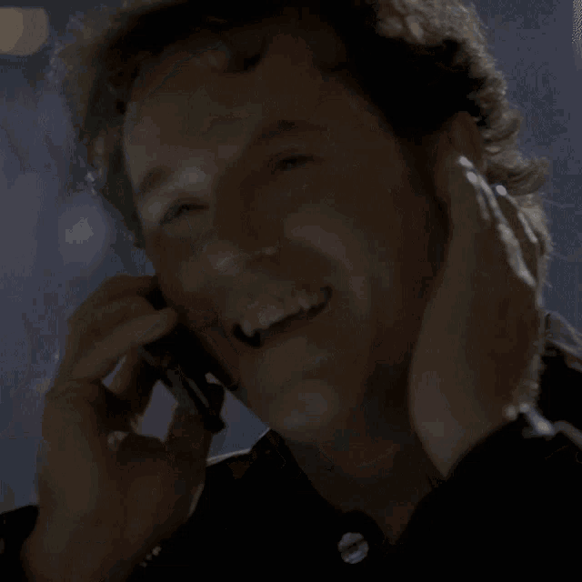 a man talking on a cell phone with the words j ' ferme ma yeule avec ca written below him