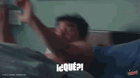 a shirtless man is taking a bath in a bathtub and saying i ? que ?
