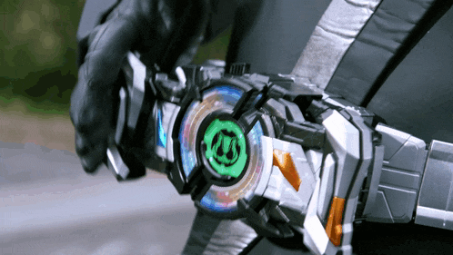 a person is holding a toy that has a green circle with the letter s on it