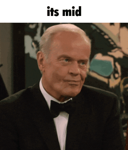 a man in a tuxedo with the words " its mid " below him
