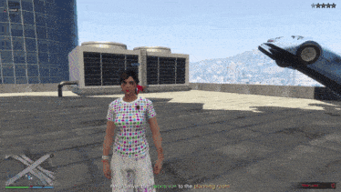 a woman in a polka dot shirt stands on a rooftop in a video game