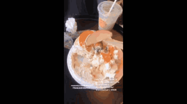 a girl with braces on her teeth is eating a piece of food