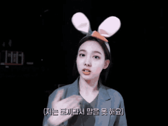 a woman with bunny ears and a carrot on her head