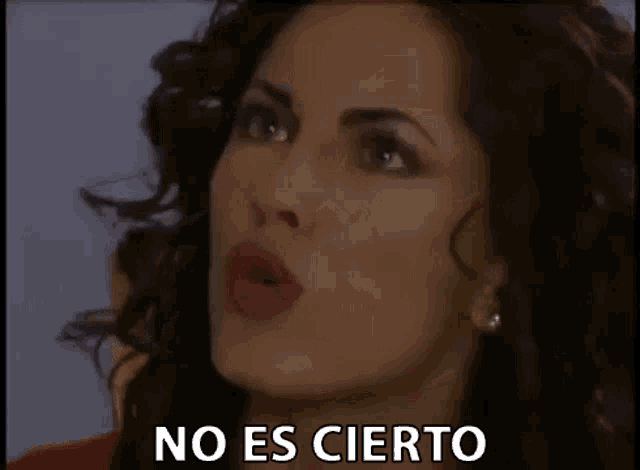 a close up of a woman 's face with the words `` no es cierto '' written on the bottom .