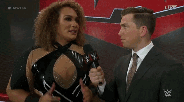 a man in a suit is talking to a woman who says " i know what i want and im going for the gold