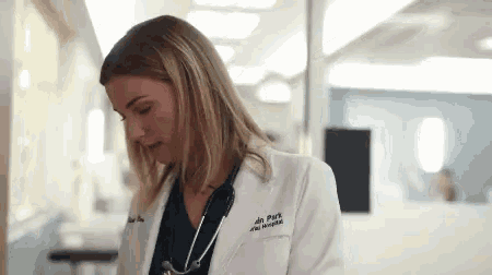a woman in a lab coat with the name dr park on the front