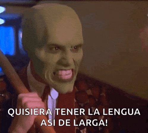 a man with a mask on his face is holding a stick and says quisiera tener la lengua asi de larga !