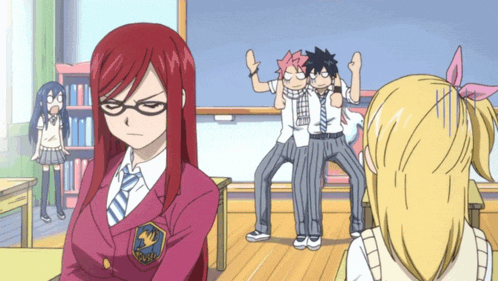 a girl with red hair is wearing glasses and a jacket with the word fairy tail on it