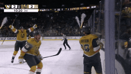 a hockey game between the golden knights and the penguins is underway
