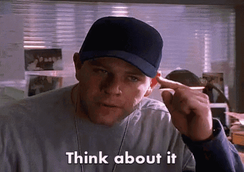 a man wearing a baseball cap is pointing at his ear and saying think about it