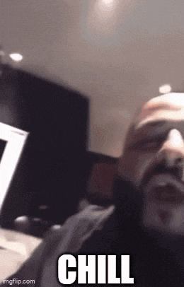 a man with a beard is taking a selfie with the words chill written on the bottom .