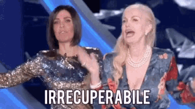 two women are standing next to each other with the word irrecuperabile written on the bottom