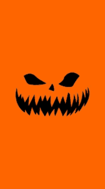 an orange background with a silhouette of a pumpkin face on it
