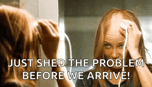 a woman is looking at her hair in the mirror with the words just shed the problem before we arrive