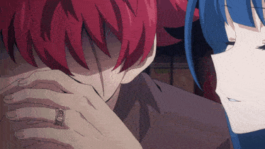 a man with red hair has a ring on his finger that says ' i love you '